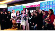 Prominent Qatari women and foreign dignitaries posing for a group picture after marking the International Women’s Day at Qatar Stock Exchange headquarters in West Bay, Doha, yesterday. 
