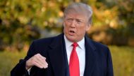 FILE PHOTO: U.S. President Donald Trump responds to a reporter's question as he departs the White House, Washington, DC, U.S., for a day trip to suburban Pittsburgh, Pennsylvania, for a Make America Great Again rally supporting Republican candidate Rick S