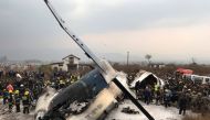 Wreckage of an airplane is pictured as rescue workers operate at Kathmandu airport, Nepal March 12, 2018. REUTERS/ Navesh Chitrakar