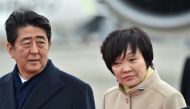 (FILES) This file picture taken on February 28, 2017 shows Japan's Prime Minister Shinzo Abe (L) and his wife Akie Abe (R) at Tokyo's Haneda Airport. AFP / KAZUHIRO NOGI