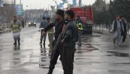 File photo of Afghan security officials standing guard at the explosion site in Kabul, Afghanistan on March 9, 2018. (Haroon Sabawoon - Anadolu Agency)
