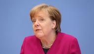 German Chancellor Angela Merkel (L) attends the signing ceremony of the conservative CDU/CSU party and the Social Democrats to form a new government in Berlin, on March 12, 2018.  Cüneyt Karada? - Anadolu
