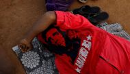 A farmer covers his face with a bandana with an image of Che Guevara as he sleeps before a rally organised by All India Kisan Sabha (AIKS) in Mumbai, India March 12, 2018. Reuters/Danish Siddiqui
