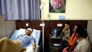 Basanta Bohara, 27, a survivor from the US-Bangla plane crash lies on a hospital bed while undergoing treatment in Kathmandu, Nepal March 12, 2018. Reuters/Navesh Chitrakar