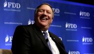 FILE PHOTO: CIA Director Mike Pompeo laughs during the FDD National Security Summit in Washington, DC, U.S., October 19, 2017. REUTERS/Yuri Gripas/File Photo
