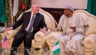 Rex Tillerson met Nigerian President Muhammadu Buhari (R) during his visit to Nigeria. (Anadolu Agency/  Nigerian Presidency Press Office handout) 