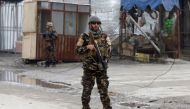 FILE PHOTO: A member of the Afghan security force keeps watch at the site of a suicide bomb attack in Kabul, Afghanistan March 2, 2018. REUTERS/Omar Sobhani/File Photo	