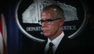 (FILES) In this file photo taken on July 12, 2017, acting FBI Director Andrew McCabe listens during a news conference to announce significant law enforcement actions at the Justice Department in Washington, DC. AFP / ALEX WONG