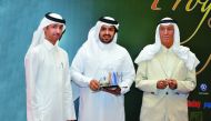 Abdulaziz Mohammed Al Sahlawi (centre), Director of Public Relations,GWC; with Faleh bin Hussein Al Hajeri (left), Director of Research and Cultural Studies at the Ministry of Culture and Sports; and Yousif bin Jassim Al Darwish, Chairman of Oryx Publishi