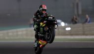 Monster Yamaha Tech 3 rider Johann Zarco of France does a wheelie during the qualifying session of the Qatar Grand Prix at Losail International Circuit yesterday.