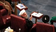 Iran's President Hassan Rouhani (C) attending a session of Iran's Assembly of Experts in the capital Tehran on March 13, 2018. / AFP / ATTA KENARE
