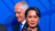 Australia's Prime Minister Malcolm Turnbull walks behind Myanmar's State Counsellor Aung San Suu Kyi during the Leaders Welcome and Family Photo at the one-off summit of 10-member Association of Southeast Asian Nations (ASEAN) in Sydney, Australia, March 