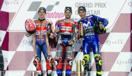 First-placed Ducati Team rider Andrea Dovizioso of Italy (centre), second-placed Repsol Honda rider Marc Marquez of Spain (left), and third-placed Movistar Yamaha rider Valentino Rossi of Italy pose on the podium yesterday. Pictures: Kammutty Vp/The Penin