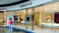 A woman walks past a Tiffany shop in Singapore May 19, 2017. Reuters/Thomas White