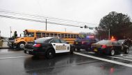 Sheriffs and Maryland State Troopers gather on March 20, 2018 at Great Mills High School in Great Mills, Maryland after a shooting at the school.  AFP / JIM WATSON
