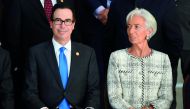 US Secretary of Treasury Steven Mnuchin (L) and IMF Managing Director Christine Lagarde sit for the family picture of the G20 Meeting of Finance Ministers and Central Bank Governors, in Buenos Aires, on March 19, 2018.  AFP / Eitan Abramovich    