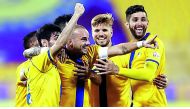 Al Gharafa players celebrate with Dutch star Wesley Sneijder (centre) after the latter scored during a QNB Stars League match in this file photo.  