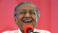 This file picture taken on March 8, 2018 shows former Malaysian prime minister and opposition's prime ministerial candidate Mahathir Mohamad smiling after launching the four-party coalition Pact of Hope (Pakatan Harapan) election manifesto in Shah Alam, o