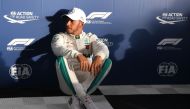 Mercedes' British driver Lewis Hamilton reacts after taking pole position after the Formula One qualifying session in Melbourne on March 24, 2018, ahead of the Formula One Australian Grand Prix