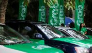 Grab cars are seen during a launch ceremony in Phnom Penh, Cambodia, December 19, 2017 (Reuters/Samrang Pring)