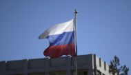 The Russian flag flies on the pole of the Embassy of Russia in Helsinki, Finland on March 27, 2018.  AFP / Lehtikuva / Vesa Moilanen
