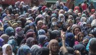 People wait to receive the food and hygiene packages distributed by Turkey's Disaster Management Agency (AFAD) in Afrin, Syria after Turkish Armed Forces and Free Syrian Army (FSA) took complete control of northwestern Syria's Afrin within the 