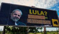 Picture of a billboard against former Brazilian President (2003-2010) Luiz Inacio Lula da Silva which was altered by his supporters in his favour, in Foz do Iguau, Parana State, Brazil, taken on March 26, 2018. AFP / Christian Rizzi