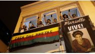Demonstrators gesture as they take part in a protest against the shooting of Rio de Janeiro city councilor Marielle Franco, in front of the Casa das Pretas (Black women's House) in Rio de Janeiro, Brazil March 22, 2018. Reuters/Ricardo Moraes