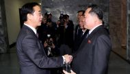 South Korean Unification Minister Cho Myoung-gyon is greeted by his North Korean counterpart Ri Son Gwon as he arrives for their meeting at the truce village of Panmunjom, North Korea, March 29, 2018. Korea Pool/Yonhap via REUTERS