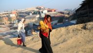FILE PHOTO: Rohingya refugees walk at Jamtoli camp in the morning in Cox's Bazar, Bangladesh, January 22, 2018. REUTERS/Mohammad Ponir Hossain/File Photo
