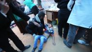 A Palestinian youth suffering from tear gas exposure during clashes with Israeli security forces following a demonstration commemorating Land Day, receives treatment in a medical tent near the border with Israel, east of Khan Yunis, in the southern Gaza S