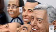 A latex mask of Mexican presidential candidate Andres Manuel Lopez Obrador (R), of the MORENA party, and those of other candidates and political figures are displayed at a Rev factory in Cuernavaca, Morelos State, Mexico, on March 28, 2018. Mexico will ho