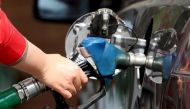 A female employee fills the tank of a car at a petrol station in Cairo, February 24, 2016 (Reuters / Mohamed Abd El Ghany) 