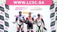The podium winners  pose for a photo yesterday at Losail International Circuit. 