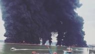 Thick plumes of smoke rise from fire at the sea near Balikpapan, Indonesia March 31, 2018 in this still image obtained from a video by social media. Instagram @Iieebarbie
