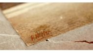 The signature of former German dictator Adolf Hitler is seen on a painting of the old registry office in Munich, at Weidler auction house in Nuremberg November 18, 2014. Reuters/Kai Pfaffenbach