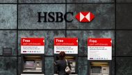 A woman uses a cash point machine at a HSBC bank in the City of London February 28, 2011. Reuters/Andrew Winning