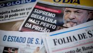 Brazilian newspapers headline the decision of the Brazilian Supreme Court (STF) that denied an habeas corpus petition for Brazilian former president Luiz Inacio Lula da Silva, in Rio de Janeiro, Brazil, on April 5, 2018.  AFP / Mauro Pimentel