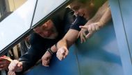 Former Brazilian President Luiz Inacio Lula da Silva waves to supporters from a window during a protest at the metallurgic trade union in Sao Bernardo do Campo, Brazil April 6, 2018. REUTERS/Leonardo Benassatto