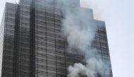 Smoke rises from the 50th floor of Trump Tower in New York, United States on April 7, 2018. Muhammed Said Tan?l - Anadolu Agency