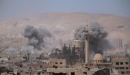 Smokes rise after Assad Regime forces carried out airstrikes in Eastern Ghouta's Douma town in Damascus, Syria on April 07, 2018.  Halil el-Abdullah - Anadolu
