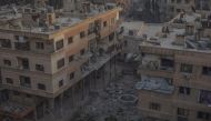 Destroyed buildings are seen after Assad Regime carried out an airstrike at Duma town of Eastern Ghouta in Damascus, Syria on April 07, 2018. Mouneb Taim - Anadolu 
