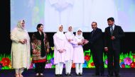Officials distribute awards to students at the fifth TNG Youth Leadership Programme at Qatar National Convention Centre recently. 