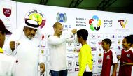 Al Gharafa player and former Dutch international football er Wesley Sneijder giving away a medal during the prize distribution ceremony.