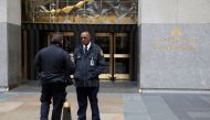 Police and security stand outside 30 Rockefeller Plaza, the location for the offices of US President Donald Trump's lawyer Michael Cohen which was raided by the F.B.I. today in the Manhattan borough of New York City, New York, U.S., April 9, 2018. REUTERS