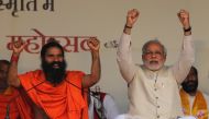 Narendra Modi and Indian yoga guru Baba Ramdev raise their hands as they chant patriotic slogans during a Yoga Mahotsav in New Delhi, March 23, 2014. (Reuters / Adnan Abidi) 