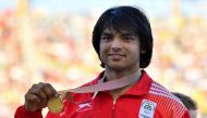 India’s Neeraj Chopra (gold) poses with his medal after the athletics men's javelin throw final during the 2018 Gold Coast Commonwealth Games at the Carrara Stadium on the Gold Coast on April 14, 2018. AFP / Saeed Khan 