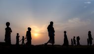  Silhouettes of Rohingya refugees are seen at Kutupalong refugee camp in Maynar Guna, near Cox's Bazar, Bangladesh on April 07, 2018. ( Arif Hüdaverdi Yaman - Anadolu Agency )