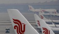 Flights of Air China are parked on the tarmac of Beijing Capital International Airport in Beijing, China, March 28, 2016. REUTERS/Kim Kyung-Hoon