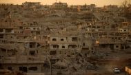 (FILES) In this file photo taken on November 16, 2017 a truck drives through a damaged street in a rebel-held area of the southern Syrian city of Daraa. AFP / Mohamad Abazeed 